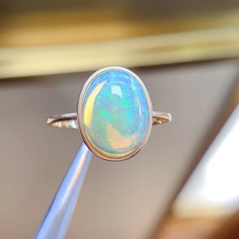 14k Gold 4.0 Ct Natural Opal Ring: Ref:230946137 // gold content:14k gold // ring size:7. 25us // // main gemstone:opal // shape:oval // carat weight:4. 0ct // color:color // treatment:natural // Low Estimate: 1400High Estimate: