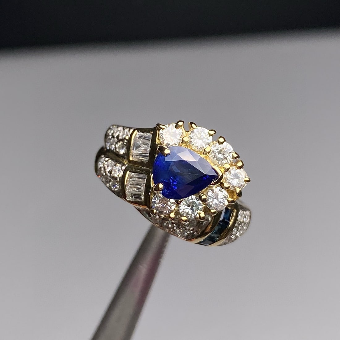14k Gold 1.63 Ctw Natural Sapphire & Diamond Ring: Ref:230946186 // gold content:14k gold // ring size:7. 25us // // main gemstone:sapphire // shape:pear // carat weight:1. 08ct // color:blue // treatment:natural // // adjacent gemstone 2 :