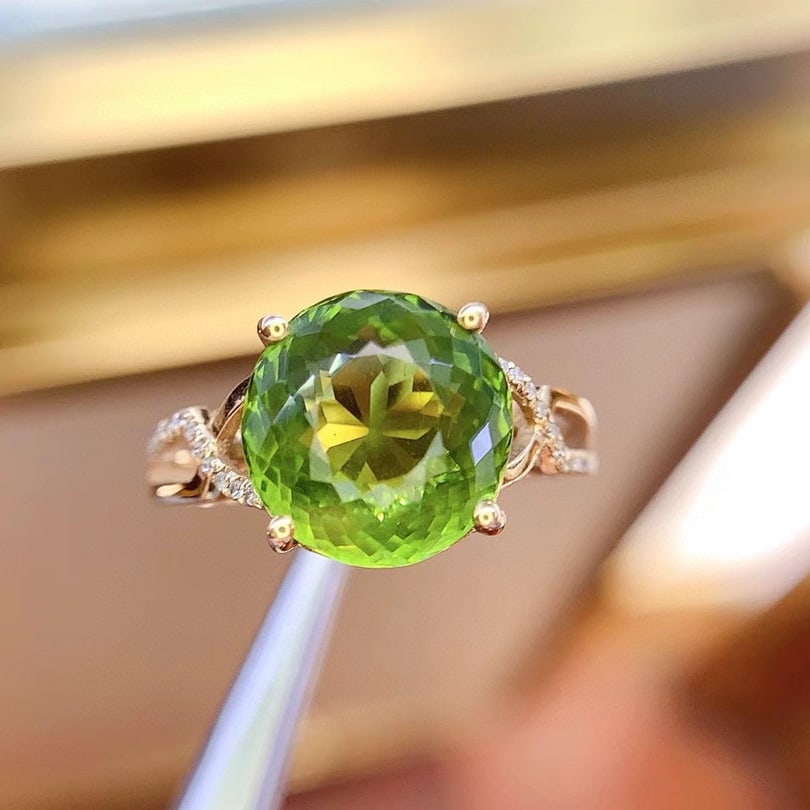 14k Gold 5.27 Ct Natural Tourmaline & Diamond Ring: Ref:230946293 // gold content:14k gold // ring size:7. 25us // // main gemstone:tourmaline // shape:oval // carat weight:5. 27ct // color:green // treatment:natural // // adjacent gemstone 2 :