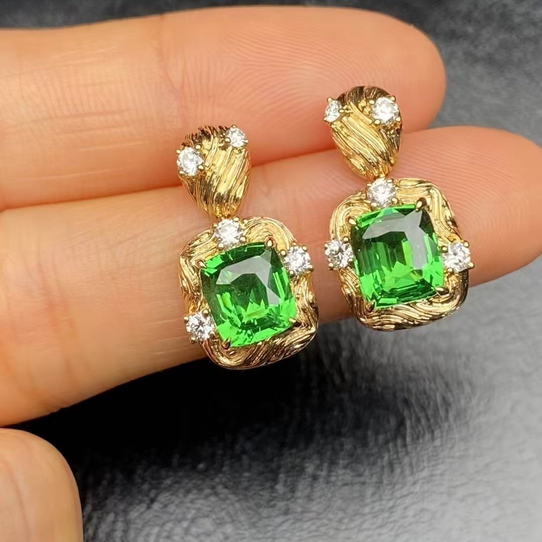 14k Gold 4.47 Ctw Natural Tsavorite & Diamond Earrings: Ref:230946371 // gold content:14k gold // main gemstone:tsavorite // shape:cushion // carat weight:4. 07ct // color:green // treatment:natural // // adjacent gemstone 2 : diamond // shape:round // car