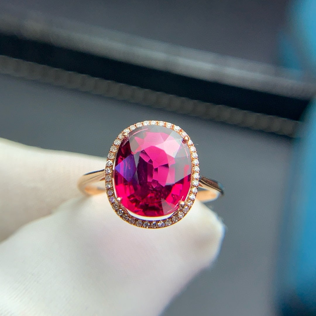 14k Gold 3.1 Ct Natural Tourmaline & Diamond Ring: Ref:230946399 // gold content:14k gold // ring size:7. 25us // // main gemstone:tourmaline // shape:oval // carat weight:3. 1ct // color:red // treatment:natural // // adjacent gemstone 2 : diamond //