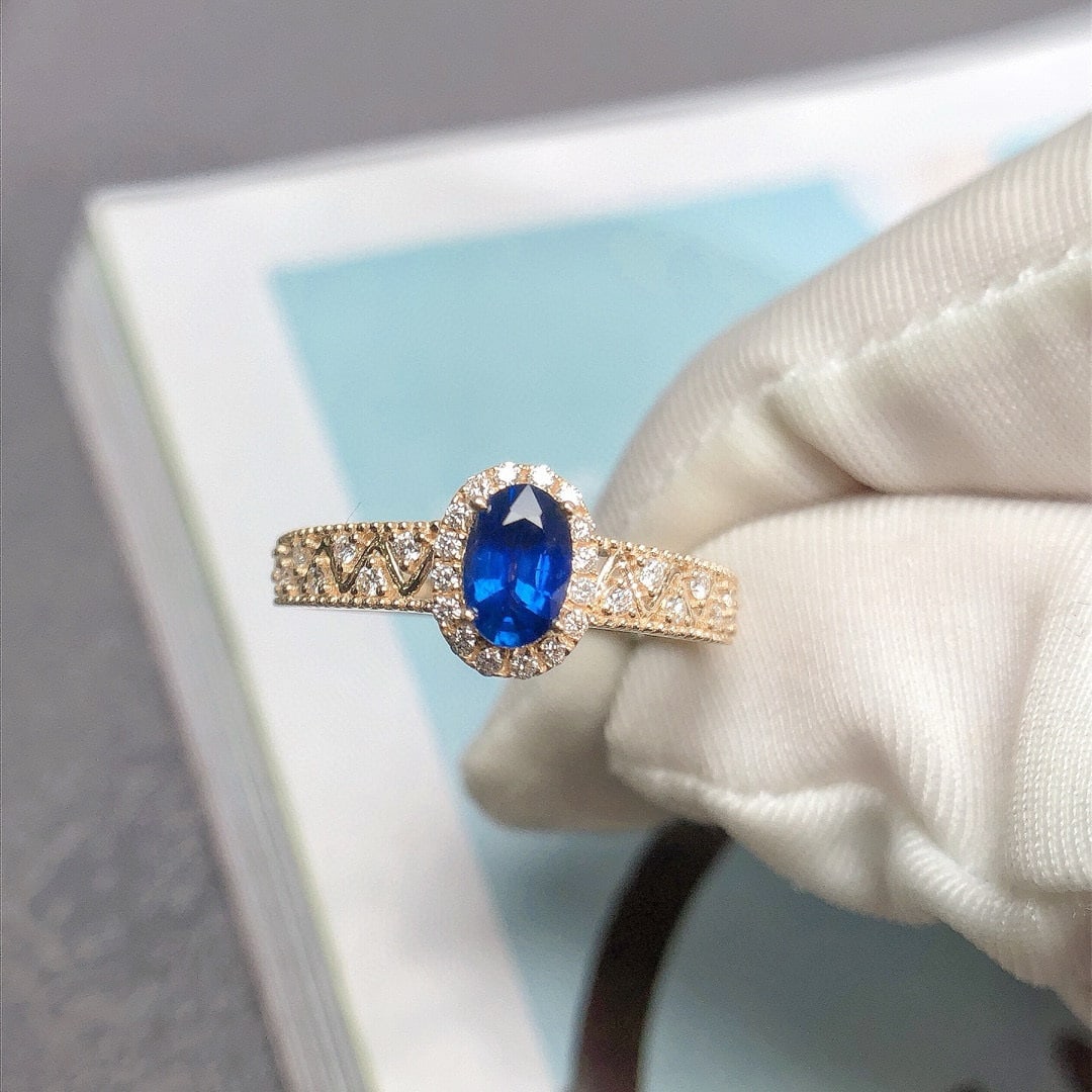 14k Gold 0.73 Ctw Vivid Blue Natural Sapphire & Diamond Ring: Ref:230946433 // gold content:14k gold // ring size:7. 25us // // main gemstone:sapphire // shape:oval // carat weight:0. 55ct // color:vivid blue // treatment:natural // // adjacent gemstone 2 :