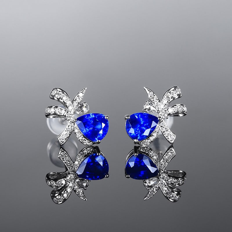 14k Gold 1.79 Ctw Vivid Blue Natural Sapphire & Diamond Earrings: Ref:230947123 // gold content:14k gold // main gemstone:sapphire // shape:pear // carat weight:1. 55ct // color:vivid blue // treatment:natural // // adjacent gemstone 2 : diamond // number of