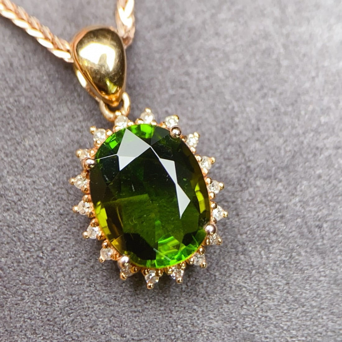 14k Gold 2.29 Ctw Natural Tourmaline & Diamond Pendant( Without Chain ): Ref:230947220 // gold content:14k gold // main gemstone:tourmaline // shape:oval // carat weight:2. 2ct // color:green // treatment:natural // // adjacent gemstone 2 : diamond // number of stones:18 /