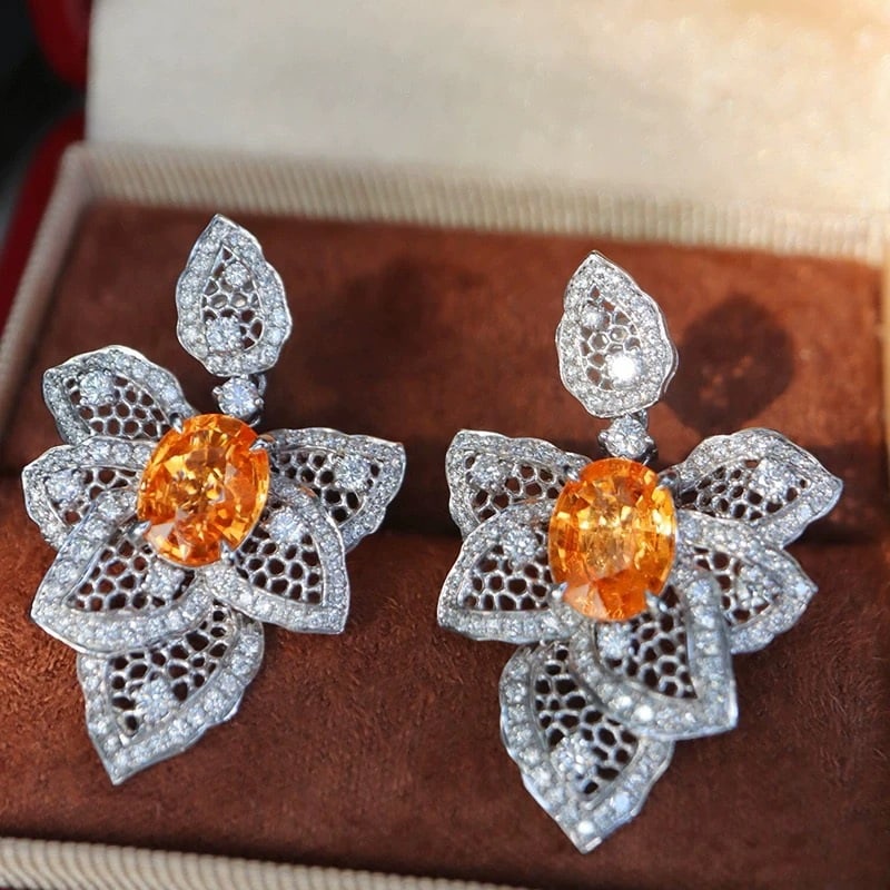 14k Gold 6.20 Ctw Natural Spessartine & Diamond Earrings: Ref:230948088 // gold content:14k gold // main gemstone:spessartine // shape:oval // carat weight:4. 55ct // color:orange // treatment:natural // // adjacent gemstone 2 : diamond // shape:round //