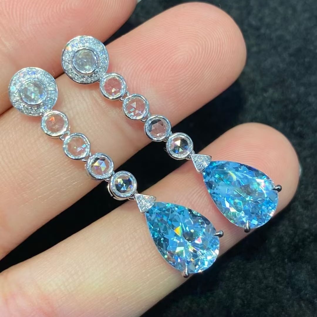 14k Gold 6.75 Ctw Natural Aquamarine & Sapphire Earrings: Ref:230948289 // gold content:14k gold // main gemstone:aquamarine // shape:pear // carat weight:5. 54ct // color:santa maria color // treatment:natural // // adjacent gemstone 2 : sapphire // shape:r