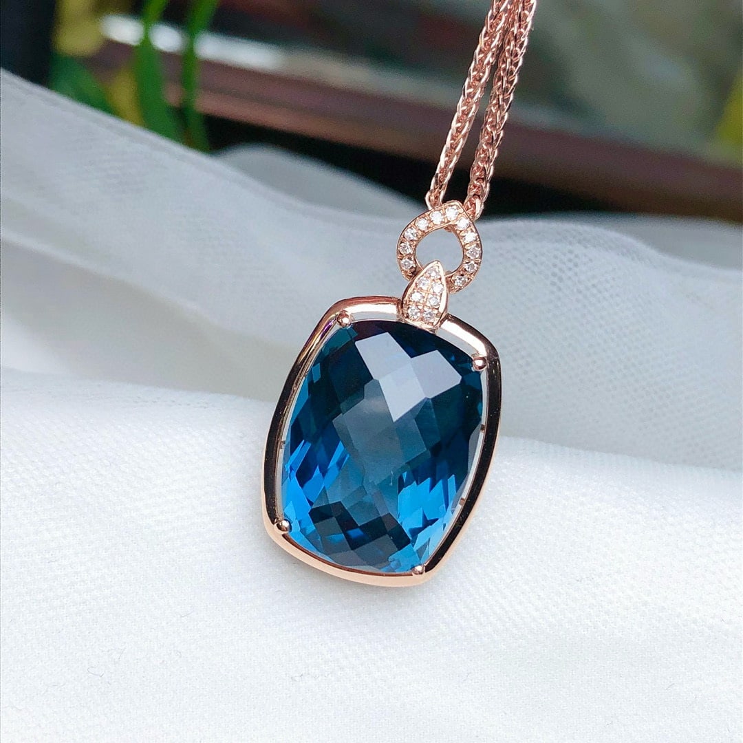 14k Gold 13.65 Ct Natural Topaz & Diamond Pendant( Without Chain ): Ref:230948329 // gold content:14k gold // main gemstone:topaz // shape:cushion // carat weight:13. 65ct // color:blue // treatment:natural // // adjacent gemstone 2 : diamond // number of stones:18 //