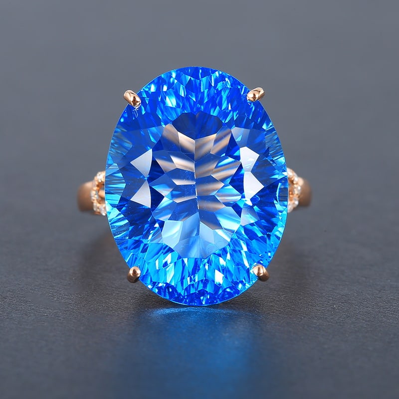 14k Gold 20.46 Ctw Natural Topaz & Diamond Ring: Ref:230955029 // gold content:14k gold // ring size:7. 25us // // main gemstone:topaz // shape:oval // carat weight:20. 4ct // color:swiss blue // treatment:natural // // adjacent gemstone 2 :