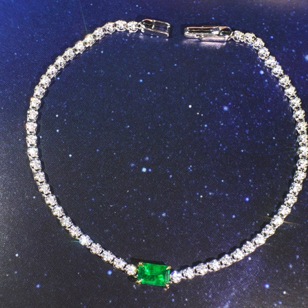 14k Gold 0.94 Ctw Vivid Green Natural Emerald & Diamond Bracelet: Ref:230955040 // gold content:14k gold // main gemstone:emerald // shape:octagonal // carat weight:0. 55ct // color:vivid green // treatment:natural // // adjacent gemstone 2 : diamond //