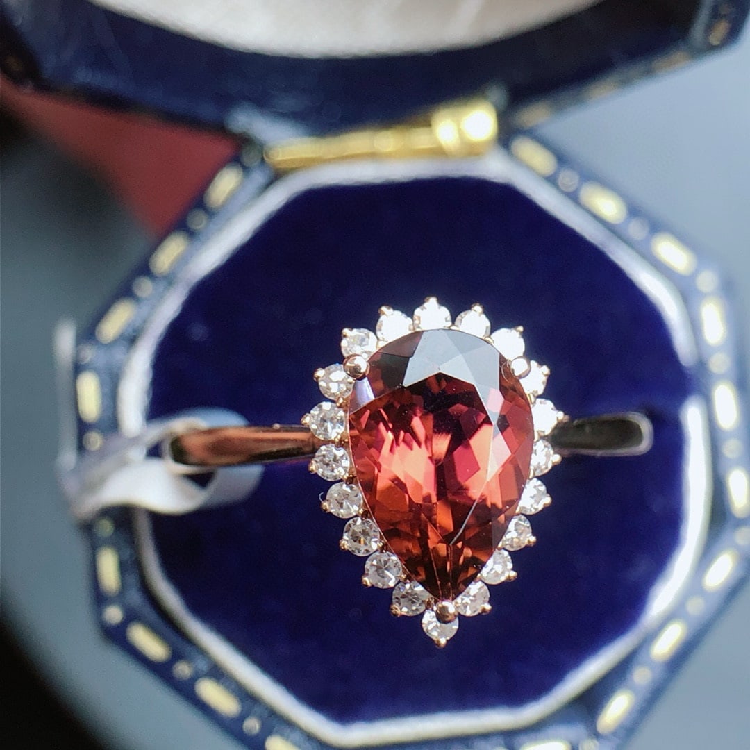 14k Gold 1.35 Ct Natural Tourmaline & Diamond Ring: Ref:230955203 // gold content:14k gold // ring size:7. 25us // // main gemstone:tourmaline // shape:pear // carat weight:1. 35ct // color:red // treatment:natural // // adjacent gemstone 2 :