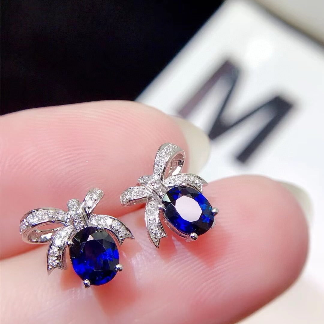 14k Gold 1.18 Ctw Vivid Blue Natural Sapphire & Diamond Earrings: Ref:230955230 // gold content:14k gold // main gemstone:sapphire // shape:oval // carat weight:1. 1ct // color:vivid blue // treatment:natural // // adjacent gemstone 2 : diamond // shape:round //