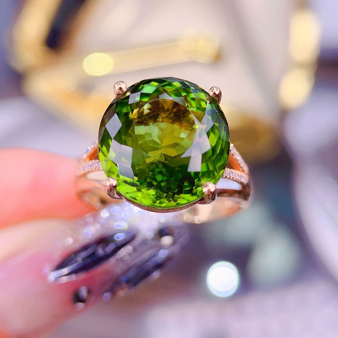 14k Gold 10.5 Ct Natural Tourmaline & Diamond Ring: Ref:230956413 // gold content:14k gold // ring size:7. 25us // // main gemstone:tourmaline // shape:oval // carat weight:10. 5ct // color:green // treatment:natural // // adjacent gemstone 2 : diamond