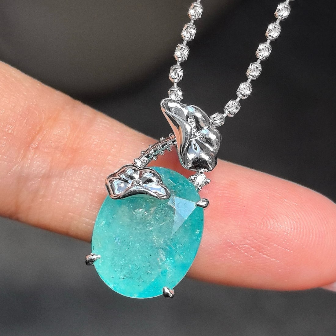 14k Gold 6.53 Ctw Natural Paraiba Tourmaline & Diamond Pendant( Without Chain ): Ref:230951016 // gold content:14k gold // main gemstone:paraiba tourmaline // shape:oval // carat weight:6. 52ct // color:neon blue // treatment:natural // // adjacent gemstone 2 : diamond //