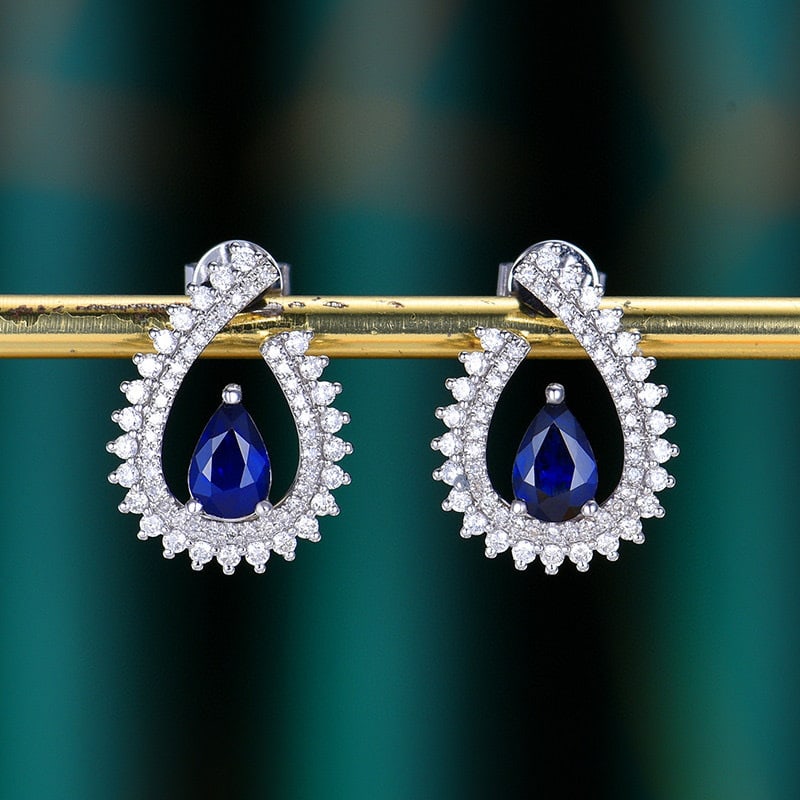 14k Gold 1.77 Ctw Vivid Blue Natural Sapphire & Diamond Earrings: Ref:230951137 // gold content:14k gold // main gemstone:sapphire // shape:pear // carat weight:1. 24ct // color:vivid blue // treatment:natural // // adjacent gemstone 2 : diamond // number of