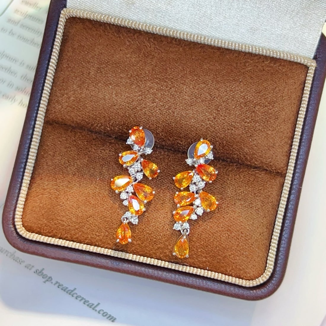 14k Gold 4.5 Ct Natural Sapphire & Diamond Earrings: Ref:230951175 // gold content:14k gold // main gemstone:sapphire // shape:pear // carat weight:4. 5ct // color:orange // treatment:natural // // adjacent gemstone 2 : diamond // number of stones:22 //