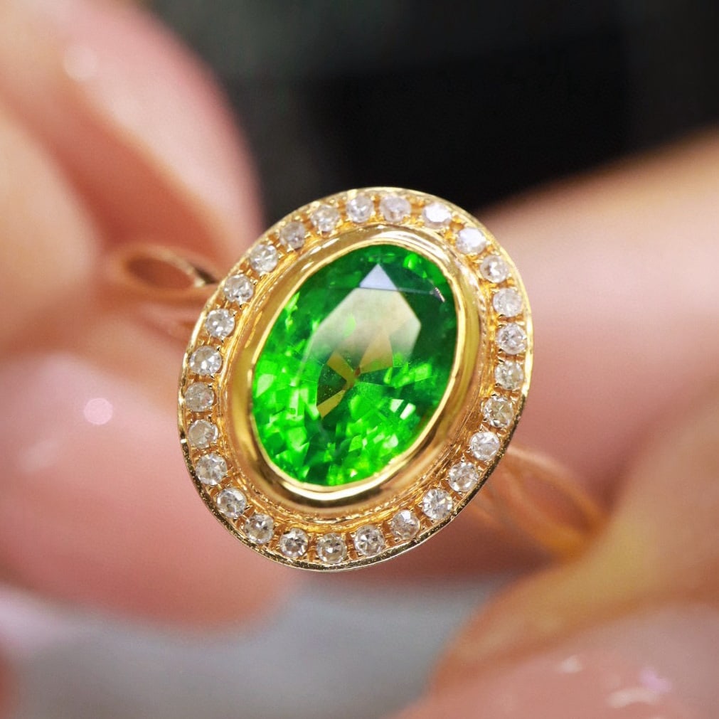 14k Gold 1.28 Ctw Natural Tsavorite & Diamond Ring: Ref:230951193 // gold content:14k gold // ring size:7. 25us // // main gemstone:tsavorite // shape:oval // carat weight:1. 2ct // color:green // treatment:natural // // adjacent gemstone 2 : diamond /