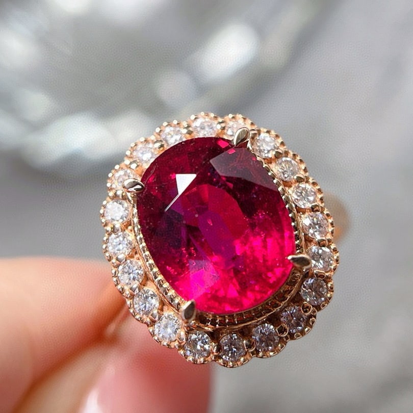 14k Gold 3.5 Ct Natural Tourmaline & Diamond Ring: Ref:230951216 // gold content:14k gold // ring size:7. 25us // // main gemstone:tourmaline // shape:oval // carat weight:3. 5ct // color:red // treatment:natural // // adjacent gemstone 2 :