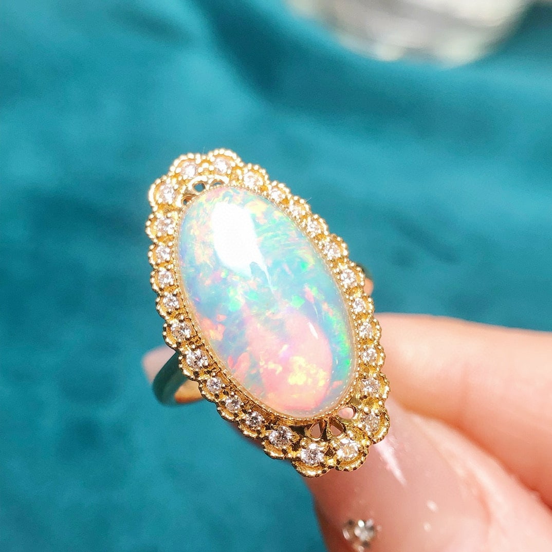 14k Gold 3.94 Ctw Natural Opal & Diamond Ring: Ref:230952046 // gold content:14k gold // ring size:7. 25us // // main gemstone:opal // shape:oval // carat weight:3. 64ct // color:color // treatment:natural // // adjacent gemstone 2 : diamond // sh