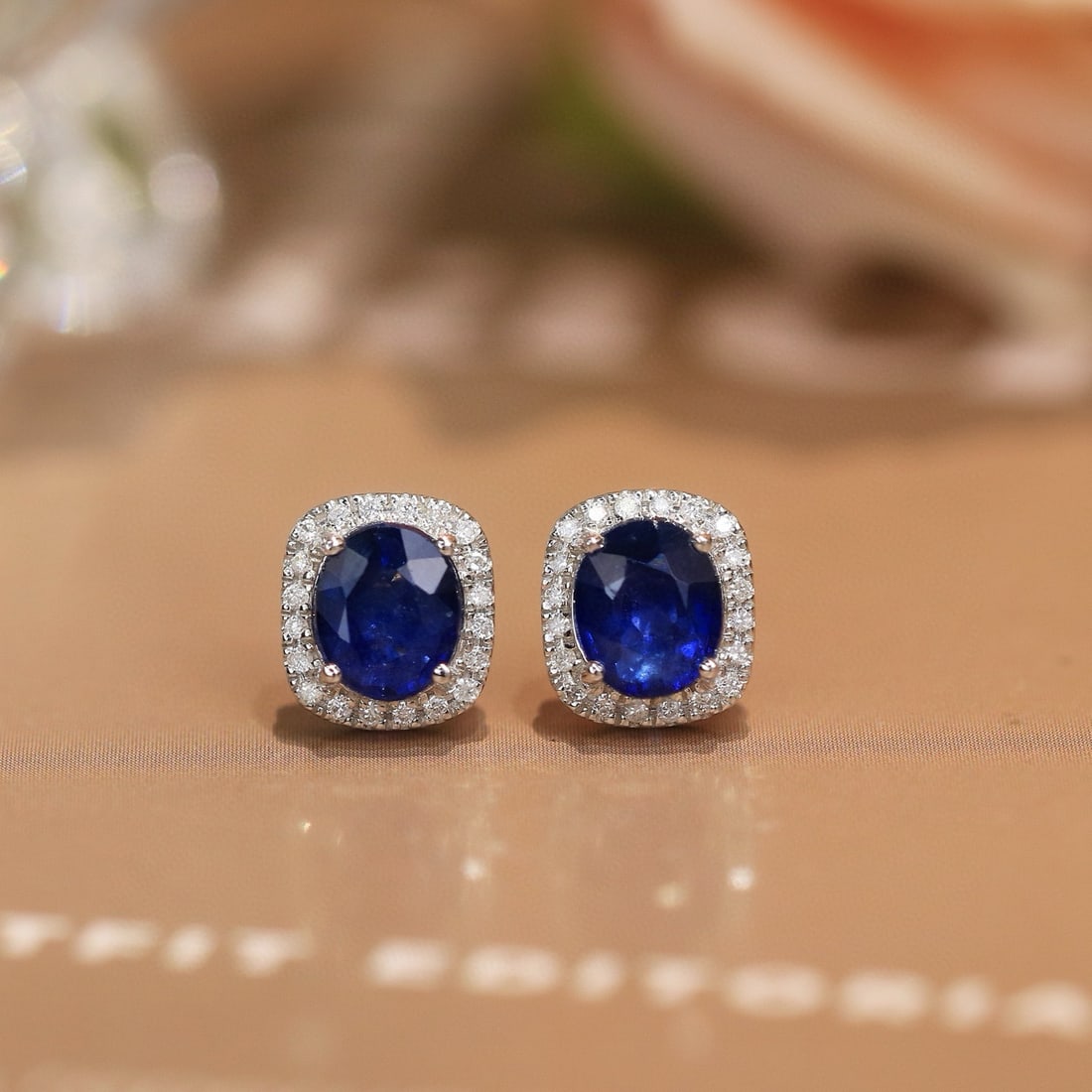 14k Gold 2.22 Ctw Natural Sapphire & Diamond Earrings: Ref:230952202 // gold content:14k gold // main gemstone:sapphire // shape:oval // carat weight:2. 06ct // color:royal blue // treatment:natural // // adjacent gemstone 2 : diamond // shape:round //