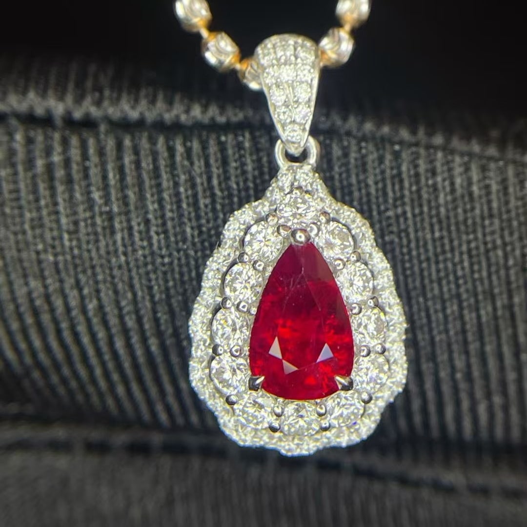 14k Gold 1.51 Ctw Natural Ruby & Diamond Pendant( Without Chain ): Ref:230952300 // gold content:14k gold // main gemstone:ruby // shape:pear // carat weight:1ct // color:pigeonblood red // treatment:natural // // adjacent gemstone 2 : diamond // shape:round // carat