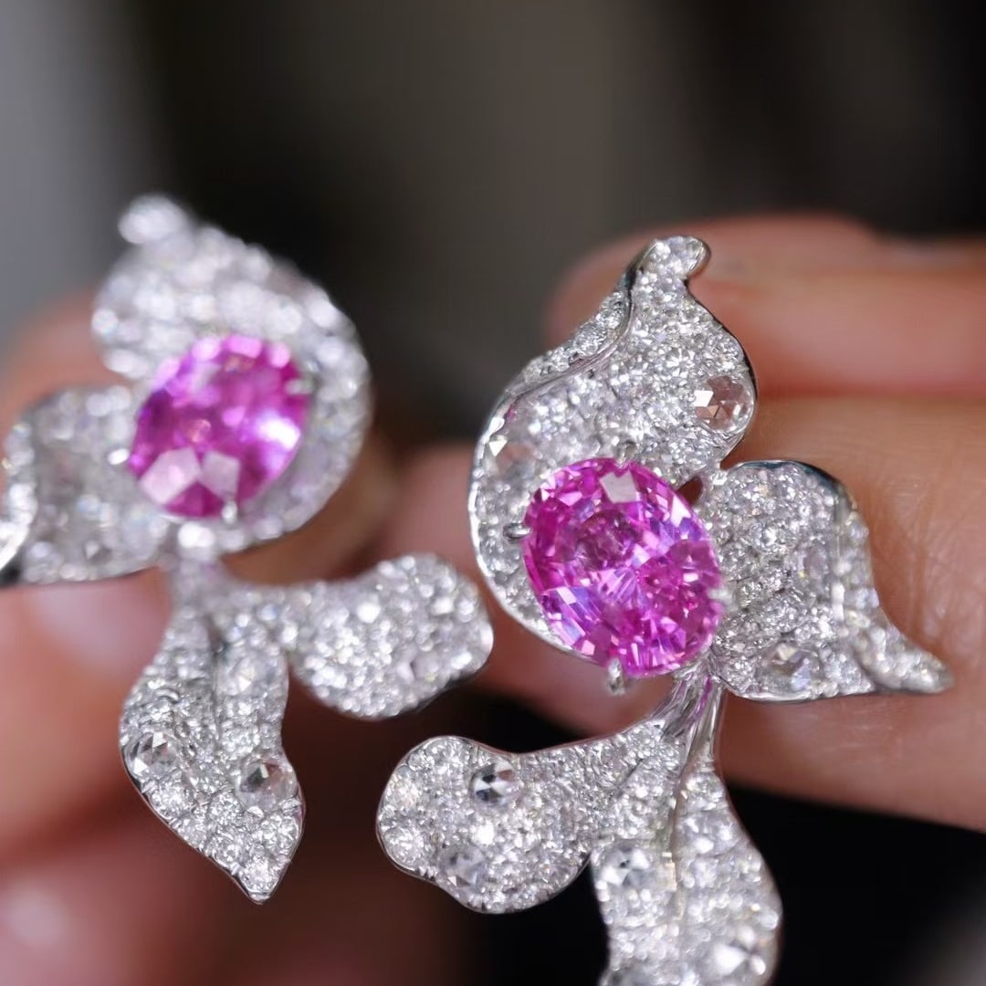 14k Gold 2.92 Ctw Natural Padparadscha Sapphire & Diamond Earrings: Ref:230952303 // gold content:14k gold // main gemstone:padparadscha sapphire // shape:oval // carat weight:2. 20ct // color:orangish pink // treatment:natural // // adjacent gemstone 2 : diamond // s