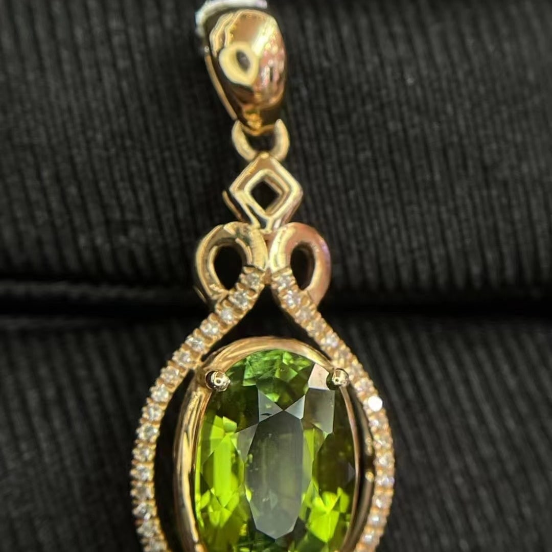 14k Gold 2.70 Ct Natural Tourmaline & Diamond Pendant( Without Chain ): Ref:230952320 // gold content:14k gold // main gemstone:tourmaline // shape:oval // carat weight:2. 70ct // color:green // treatment:natural // // adjacent gemstone 2 : diamond // number of
