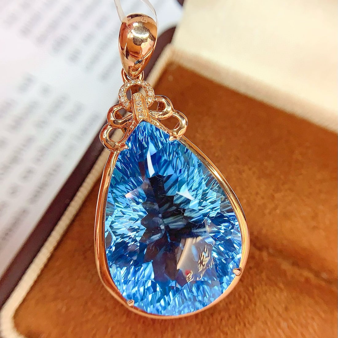 14k Gold 34 Ct Natural Topaz & Diamond Pendant( Without Chain ): Ref:230954187 // gold content:14k gold // main gemstone:topaz // shape:pear // carat weight:34ct // color:blue // treatment:natural // // adjacent gemstone 2 : diamond // number of stones:15 //