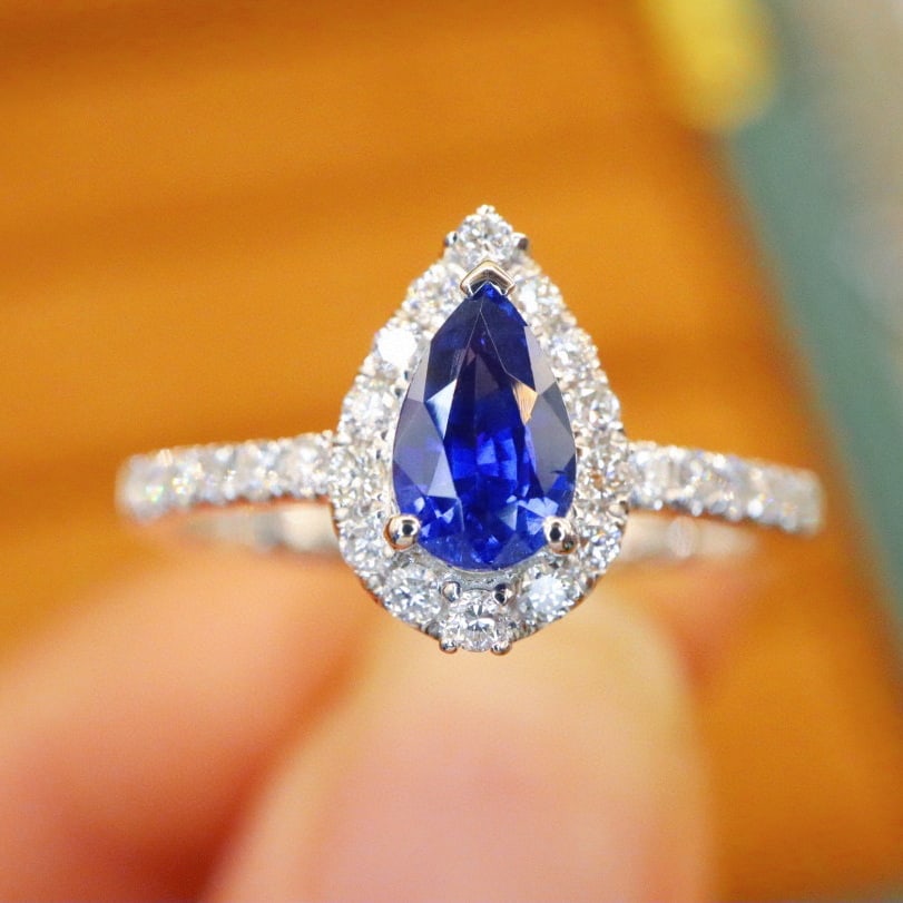 14k Gold 1.01 Ctw Natural Sapphire & Diamond Ring: Ref:230954218 // gold content:14k gold // ring size:7. 25us // // main gemstone:sapphire // shape:pear // carat weight:0. 70ct // color:royal blue // treatment:natural // // adjacent gemstone 2 : diam