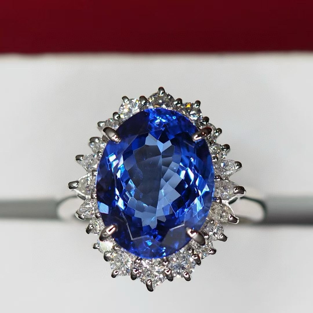 14k Gold 6.65 Ctw Natural Tanzanite & Diamond Ring: Ref:230954259 // gold content:14k gold // ring size:7. 25us // // main gemstone:tanzanite // shape:oval // carat weight:5. 94ct // color:blue // treatment:natural // // adjacent gemstone 2 :