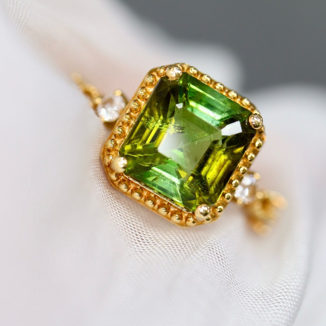 14k Gold 3.86 Ctw Natural Tourmaline & Diamond Ring: Ref:230957032 // gold content:14k gold // ring size:7. 25us // // main gemstone:tourmaline // shape:octagonal // carat weight:3. 63ct // color:green // treatment:natural // // adjacent gemstone 2