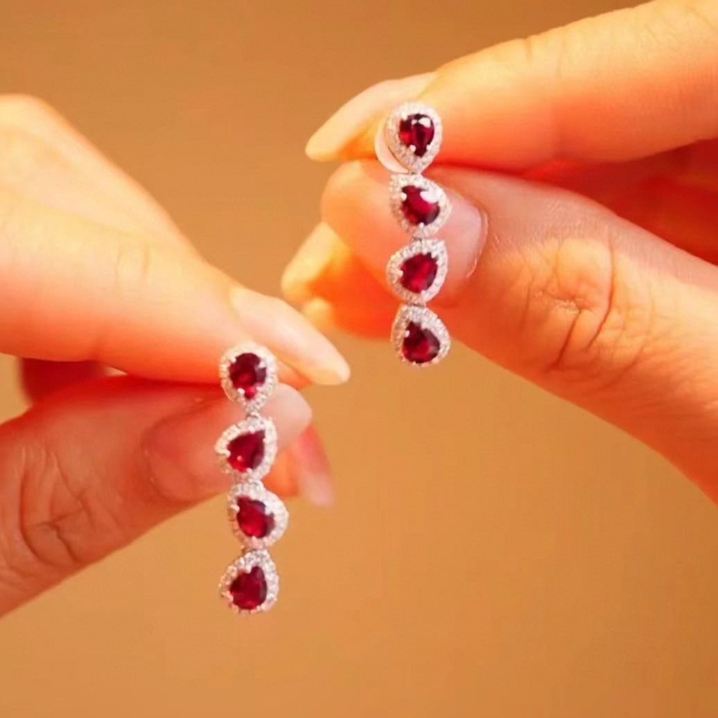 14k Gold 1.72 Ctw Natural Ruby & Diamond Earrings: Ref:230957052 // gold content:14k gold // main gemstone:ruby // shape:pear // carat weight:1. 4ct // color:pigeonblood red // treatment:natural // // adjacent gemstone 2 : diamond // shape:round //