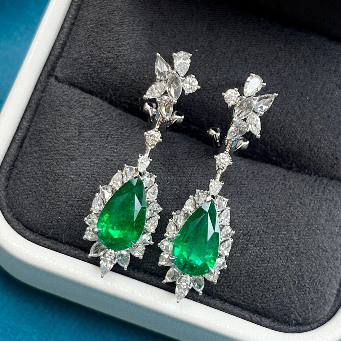 14k Gold 5.63 Ctw Vivid Green Natural Emerald & Diamond Earrings: Ref:230957081 // gold content:14k gold // main gemstone:emerald // shape:pear // carat weight:4. 10ct // color:vivid green // treatment:natural // // adjacent gemstone 2 : diamond // shape:multiply