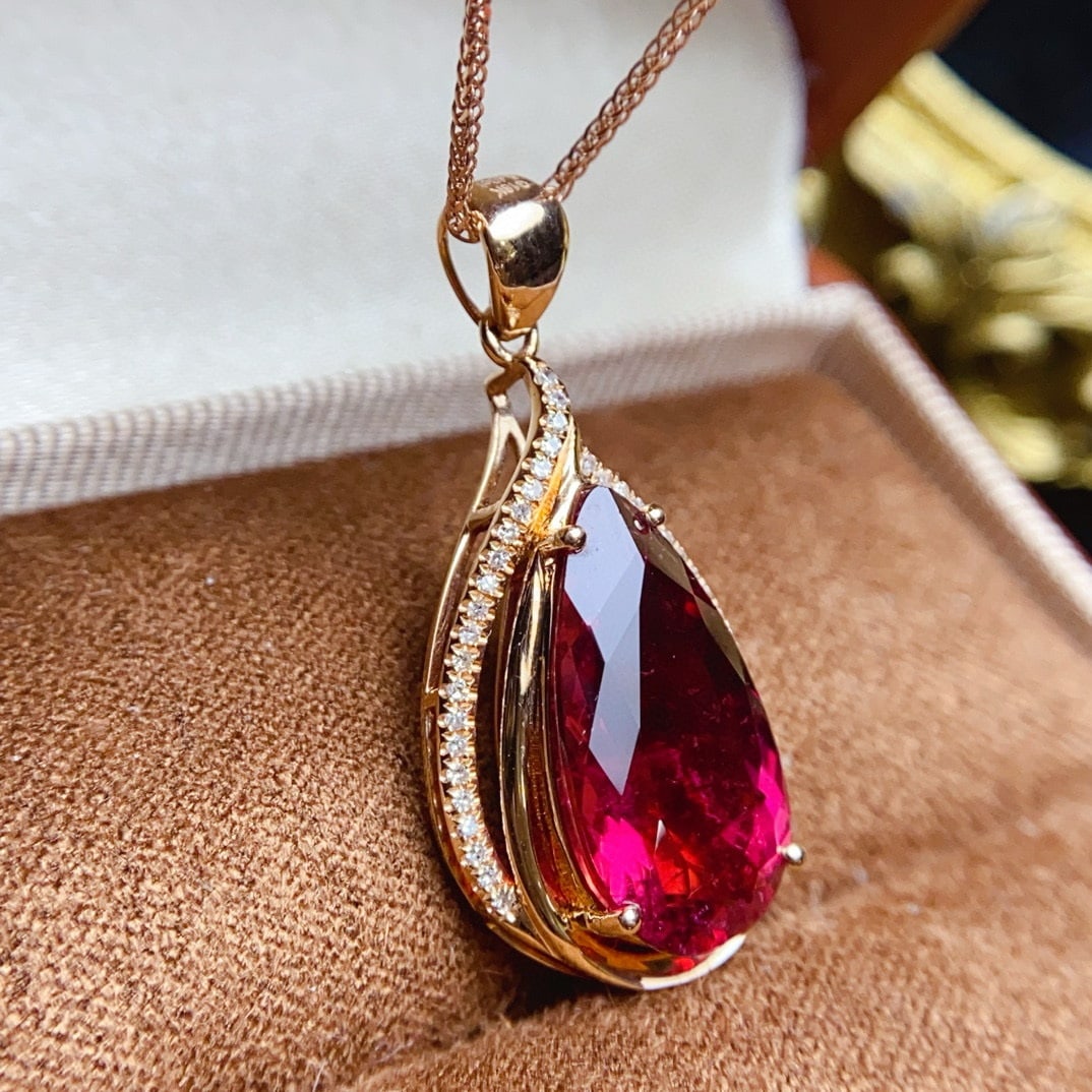 14k Gold 5.52 Ctw Natural Tourmaline & Diamond Pendant( Without Chain ): Ref:230957101 // gold content:14k gold // main gemstone:tourmaline // shape:pear // carat weight:5. 4ct // color:red // treatment:natural // // adjacent gemstone 2 : diamond // number of stones:40 //