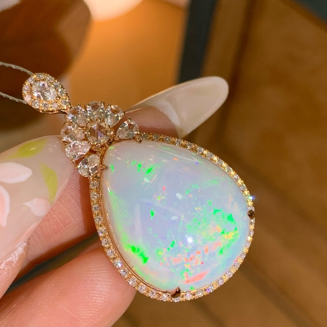 14k Gold 18.74 Ctw Natural Opal & Diamond Pendant( Without Chain ): Ref:230958017 // gold content:14k gold // main gemstone:opal // shape:pear // carat weight:18. 5ct // color:white // treatment:natural // // adjacent gemstone 2 : diamond // shape:round // carat weigh