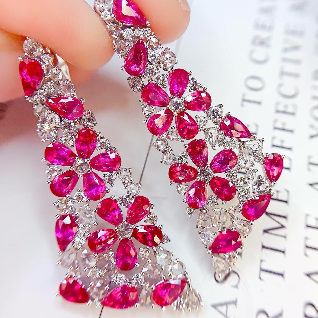14k Gold 12.6 Ct Natural Ruby & Diamond Earrings: Ref:230958392 // gold content:14k gold // main gemstone:ruby // shape:pear // carat weight:12. 6ct // color:red // treatment:natural // // adjacent gemstone 2 : diamond // number of stones:96 // shape