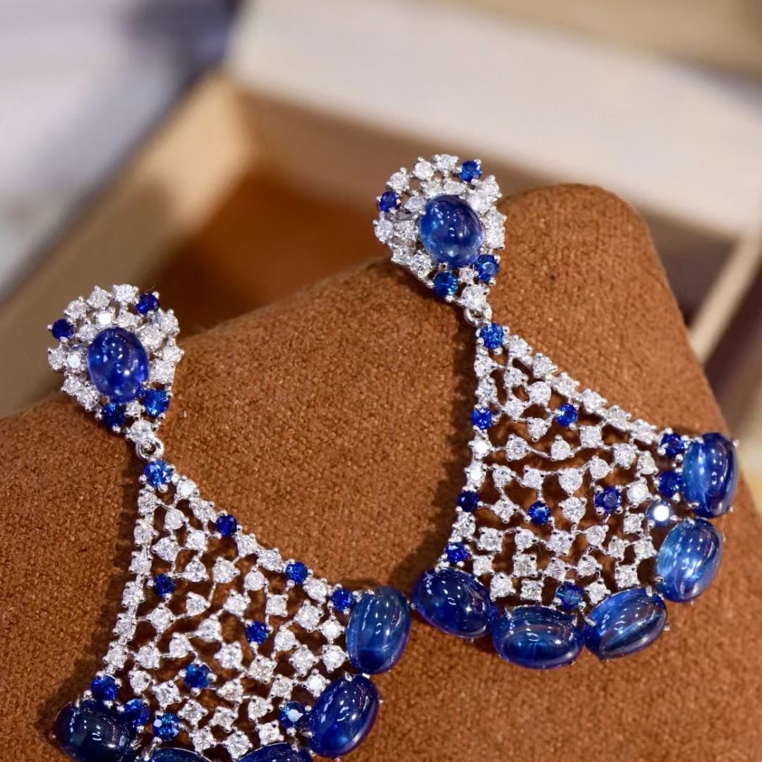 14k Gold 10.11 Ctw Natural Sapphire & Diamond Earrings: Ref:230963047 // gold content:14k gold // main gemstone:sapphire // shape:oval // carat weight:8. 81ct // color:blue // treatment:natural // // adjacent gemstone 2 : diamond // shape:round // carat we