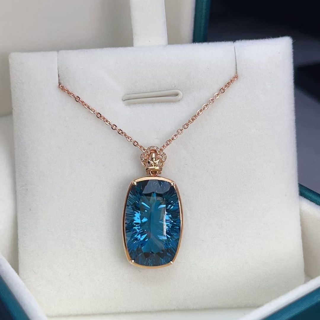 14k Gold 16.75 Ct Natural Topaz & Diamond Pendant( Without Chain ): Ref:230964187 // gold content:14k gold // main gemstone:topaz // shape:cushion // carat weight:16. 75ct // color:blue // treatment:natural // // adjacent gemstone 2 : diamond // number of stones:10