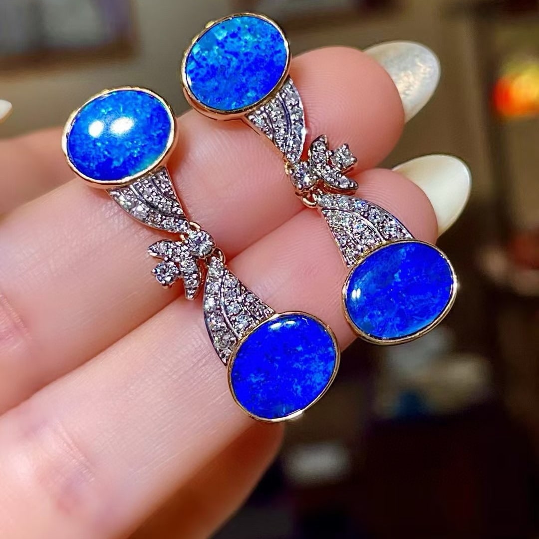 14k Gold 6.36 Ctw Natural Opal & Diamond Earrings: Ref:230965026 // gold content:14k gold // main gemstone:opal // shape:oval // carat weight:5. 9ct // color:blue // treatment:natural // // adjacent gemstone 2 : diamond // shape:round // carat
