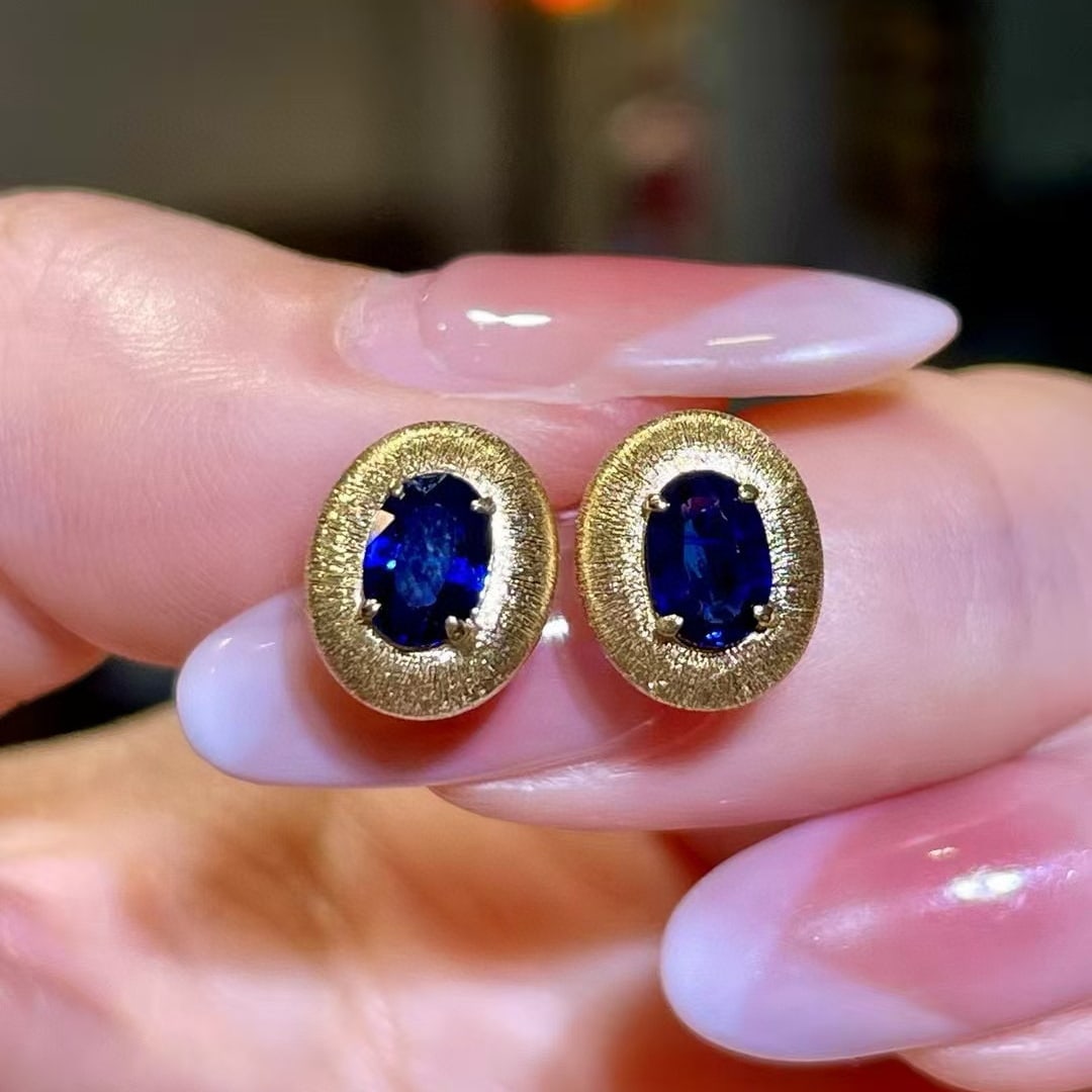 14k Gold 1.13 Ct Vivid Blue Natural Sapphire Earrings: Ref:230965170 // gold content:14k gold // main gemstone:sapphire // shape:oval // carat weight:1. 13ct // color:vivid blue // treatment:natural // Condition: New Low Estimate: 4000.00 High Estimate: