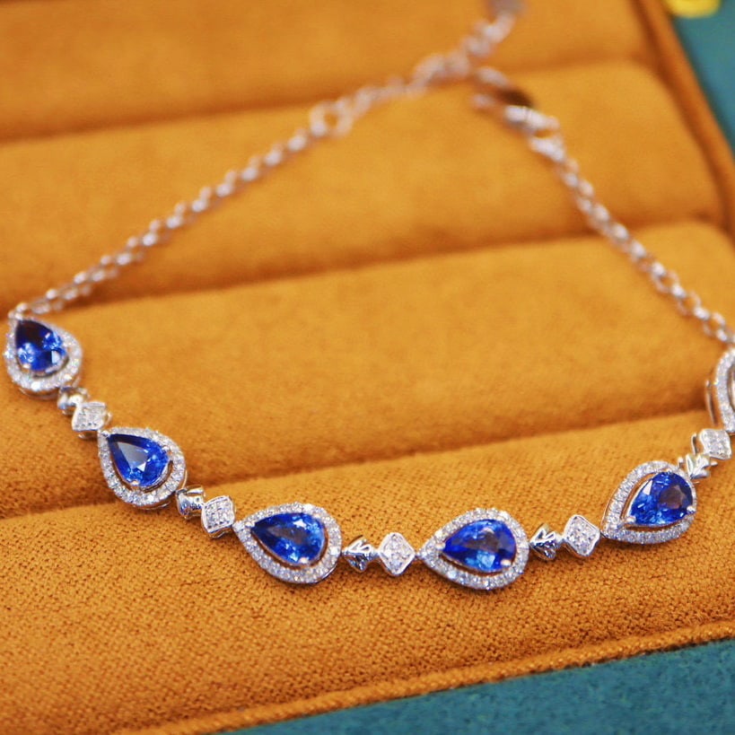 14k Gold 3.77 Ctw Natural Sapphire & Diamond Bracelet: Ref:230966052 // gold content:14k gold // main gemstone:sapphire // shape:pear // carat weight:3. 32ct // color:cornflower blue // treatment:natural // // adjacent gemstone 2 : diamond // number of