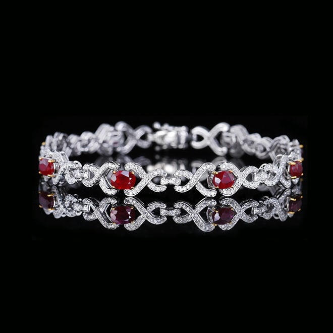 14k Gold 4.29 Ctw Natural Ruby & Diamond Bracelet: Ref:230977058 // gold content:14k gold // main gemstone:ruby // shape:oval // carat weight:3. 31ct // color:red // treatment:natural // // adjacent gemstone 2 : diamond // number of stones:389 //