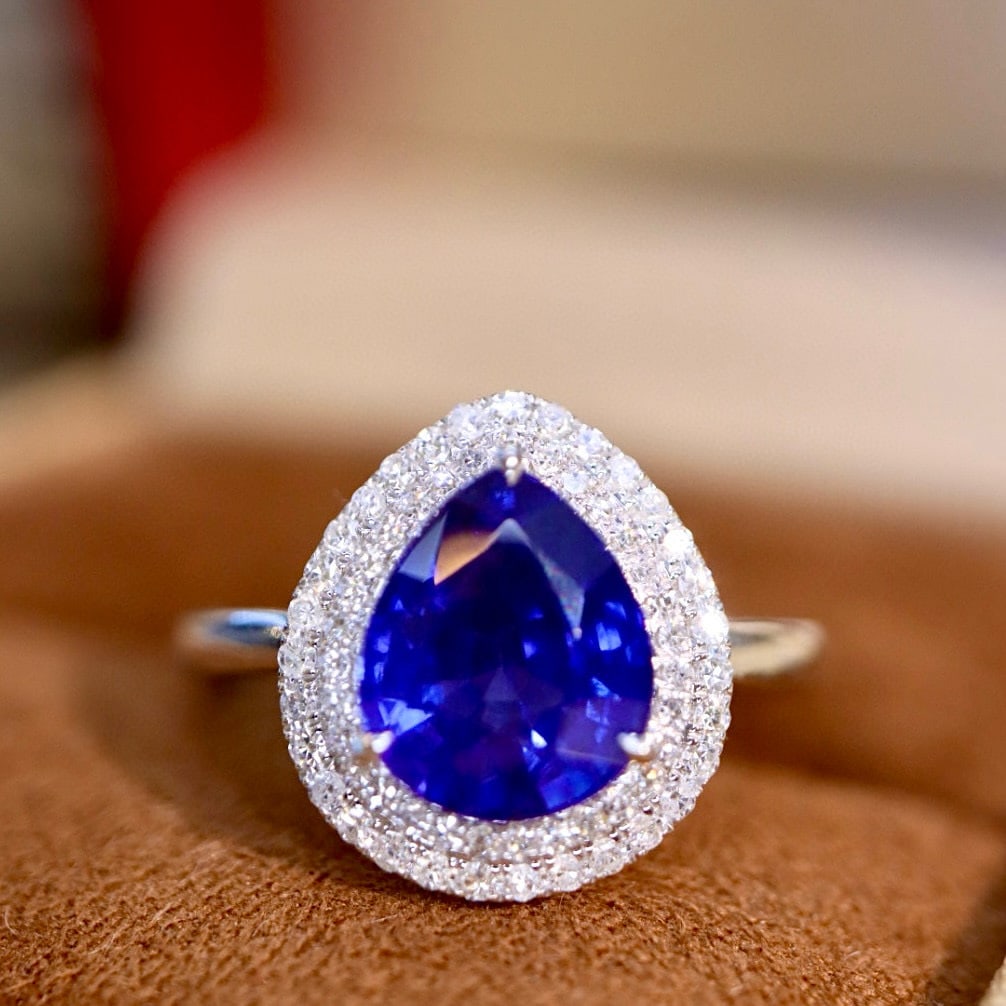 14k Gold 3.15 Ctw Natural Sapphire & Diamond Ring: Ref:230977094 // gold content:14k gold // ring size:7. 25us // // main gemstone:sapphire // shape:pear // carat weight:2. 95ct // color:blue // treatment:natural // // adjacent gemstone 2 : diamond