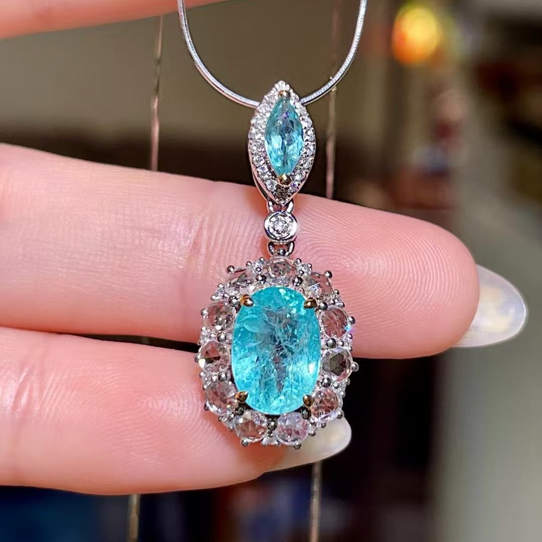 14k Gold 3.14 Ctw Natural Paraiba Tourmaline & Diamond Pendant( Without Chain ): Ref:230977187 // gold content:14k gold // main gemstone:paraiba tourmaline // shape:oval // carat weight:2. 26ct // color:neon blue // treatment:natural // // adjacent gemstone 2 : diamond //