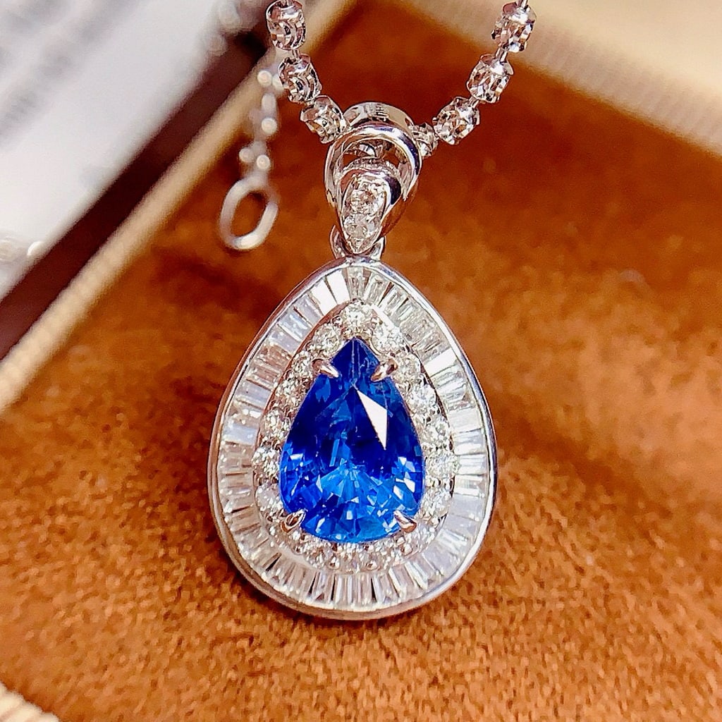 14k Gold 1.8 Ct Natural Sapphire & Diamond Pendant( Without Chain ): Ref:230977200 // gold content:14k gold // main gemstone:sapphire // shape:pear // carat weight:1. 8ct // color:blue // treatment:natural // // adjacent gemstone 2 : diamond // number of stones:63 //