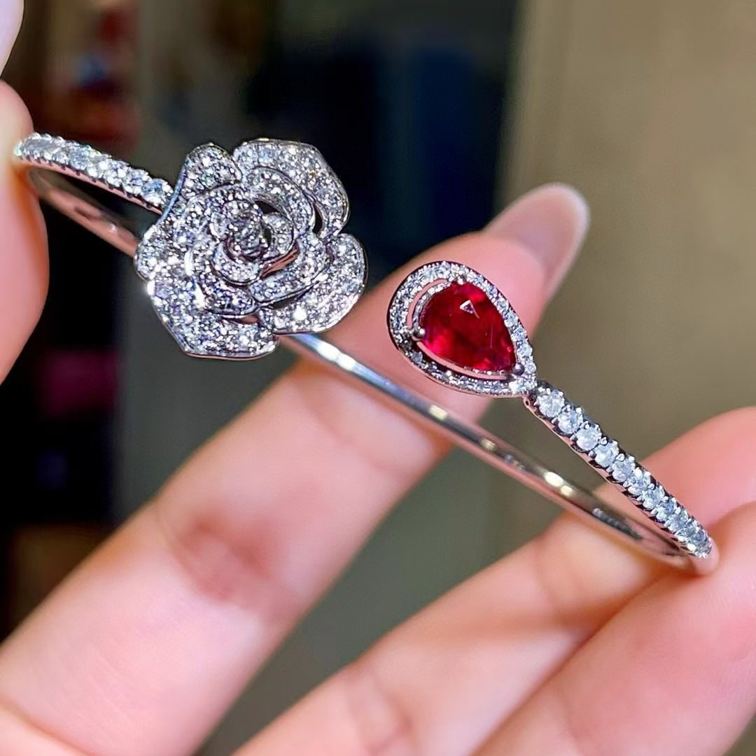 14k Gold 2.05 Ctw Natural Ruby & Diamond Bangle: Ref:230977229 // gold content:14k gold // main gemstone:ruby // shape:pear // carat weight:1. 0ct // color:red // treatment:natural // // adjacent gemstone 2 : diamond // shape:round // carat weight:1