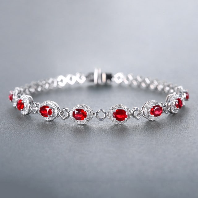 14k Gold 2.81 Ctw Natural Ruby & Diamond Bracelet: Ref:230978018 // gold content:14k gold // main gemstone:ruby // shape:oval // carat weight:2. 36ct // color:pigeonblood red // treatment:natural // // adjacent gemstone 2 : diamond // number of
