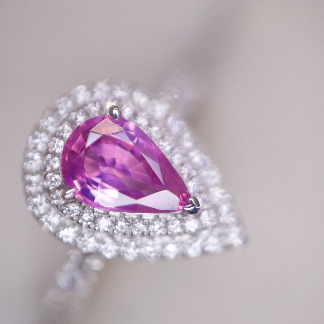 14k Gold 1.20 Ctw Natural Padparadscha Sapphire & Diamond Ring: Ref:230983104 // gold content:14k gold // ring size:7. 25us // // main gemstone:padparadscha sapphire // shape:pear // carat weight:0. 86ct // color:orangish pink // treatment:natural // // adjacent