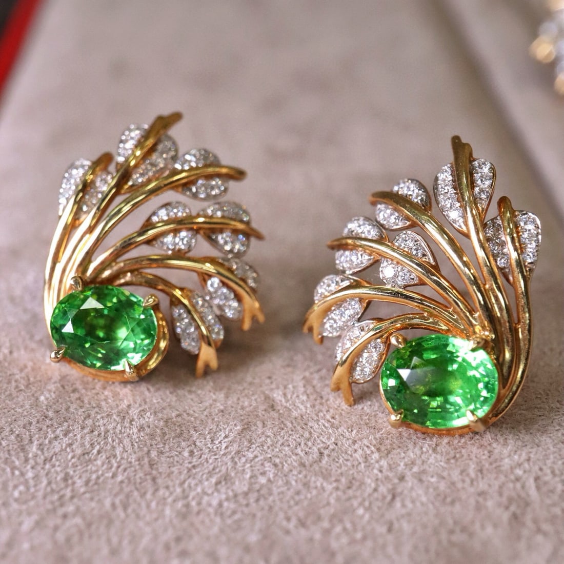 14k Gold 2.88 Ctw Natural Tsavorite & Diamond Earrings: Ref:230983106 // gold content:14k gold // main gemstone:tsavorite // shape:oval // carat weight:2. 55ct // color:green // treatment:natural // // adjacent gemstone 2 : diamond // shape:round // carat 