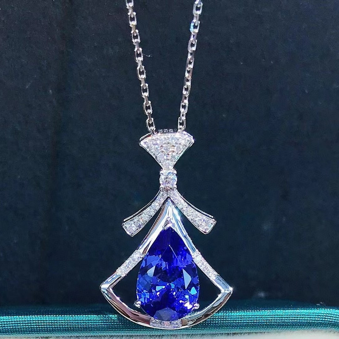 14k Gold 2.63 Ctw Natural Tanzanite & Diamond Pendant( Without Chain ): Ref:230983131 // gold content:14k gold // main gemstone:tanzanite // shape:pear // carat weight:2. 49ct // color:blue // treatment:natural // // adjacent gemstone 2 : diamond // shape:round // carat