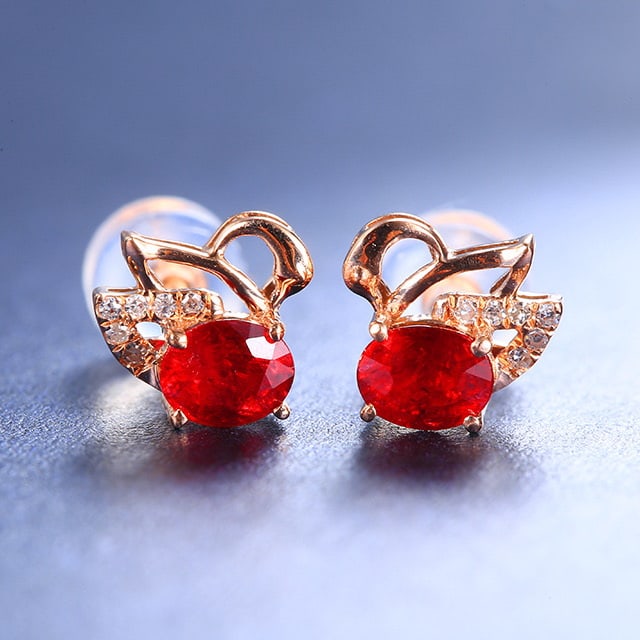14k Gold 0.78 Ctw Natural Ruby & Diamond Earrings: Ref:230984044 // gold content:14k gold // main gemstone:ruby // shape:oval // carat weight:0. 75ct // color:red // treatment:natural // // adjacent gemstone 2 : diamond // number of stones:12 //